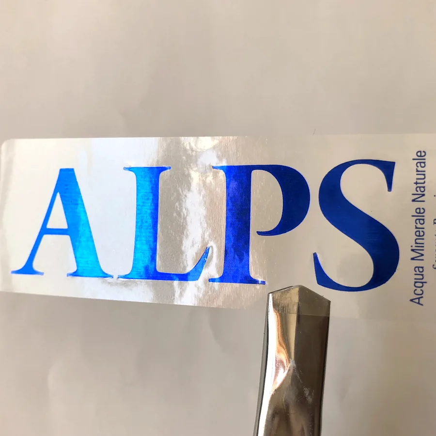 Stack of printed bottled-water labels in blue and white