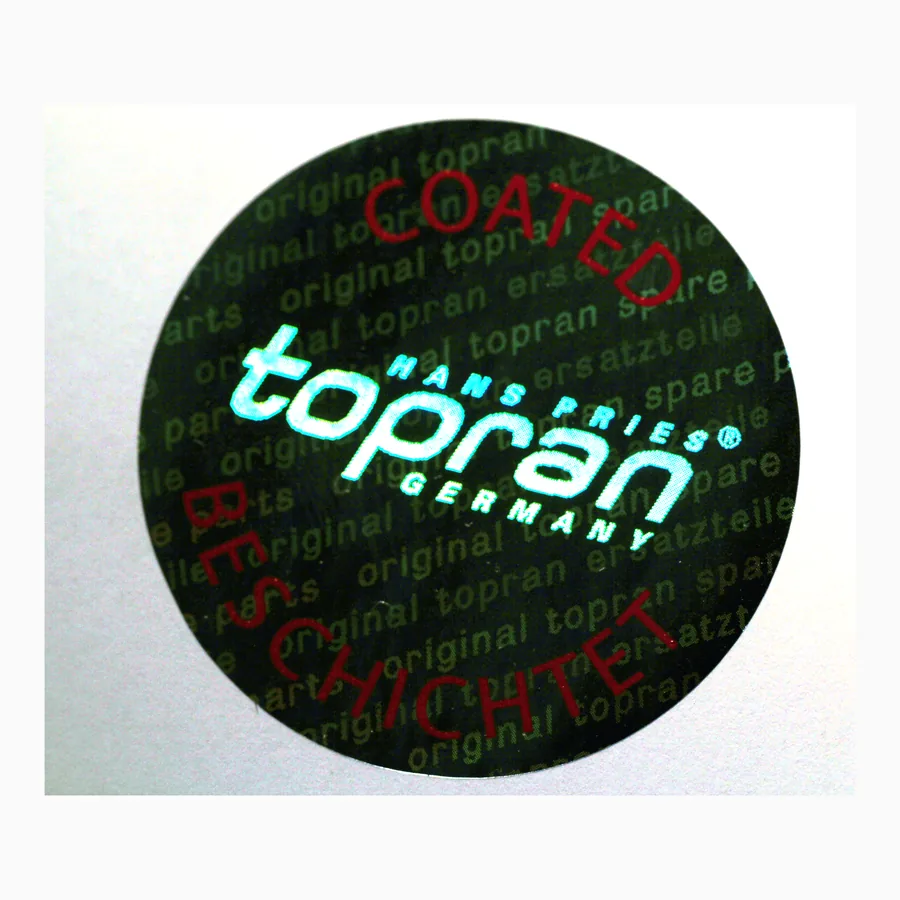Round hologram sticker with a brand wordmark over a dense field of holographic micro-text